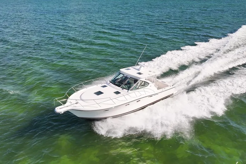  Yacht Photos Pics A 2006 Tiara 3600 yacht cruising swiftly on clear green waters.