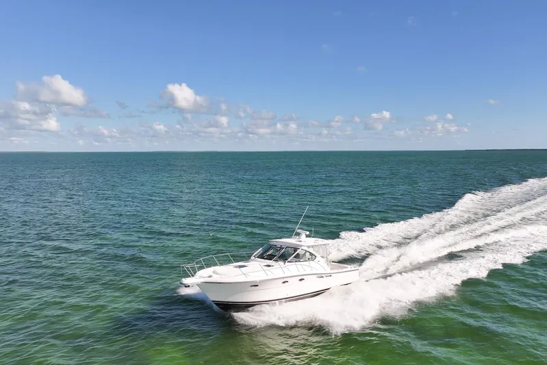  Yacht Photos Pics 2006 Tiara 3600 yacht cruising on open sea under clear blue sky.