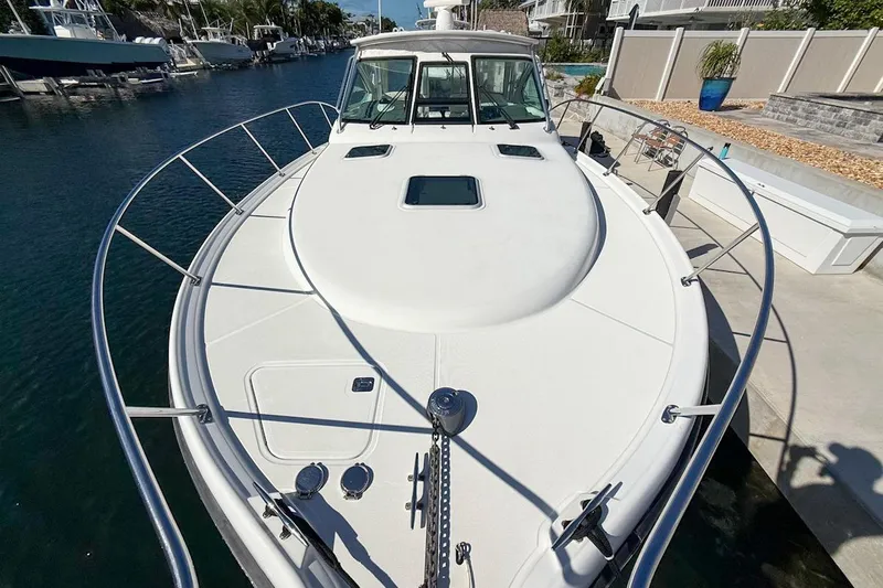  Yacht Photos Pics 2006 Tiara 3600 yacht docked, showcasing spacious deck and sleek design.