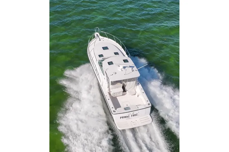  Yacht Photos Pics 2006 Tiara 3600 boat cruising on open water, aerial view.