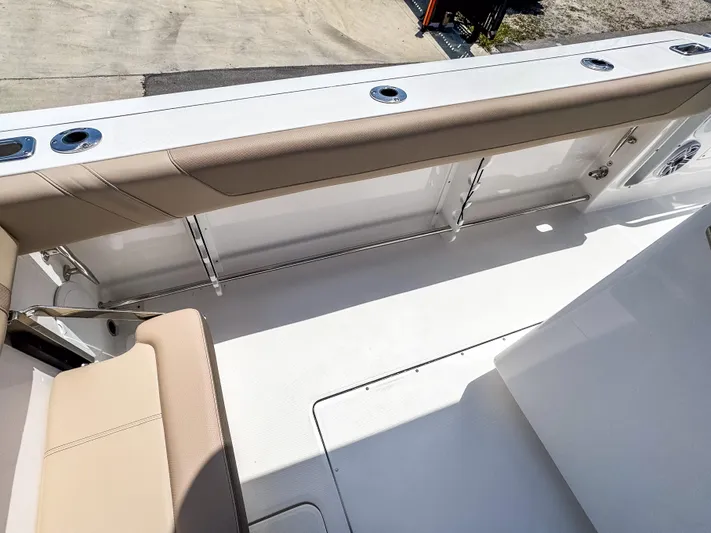  Yacht Photos Pics 2025 Edgewater 325CC boat interior with beige seating and sleek design.