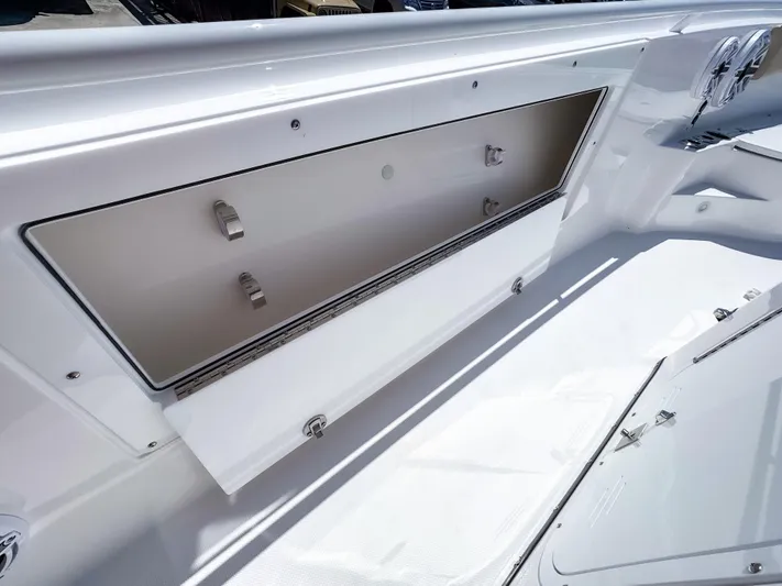  Yacht Photos Pics 2025 Edgewater 325CC boat storage compartment, open and spacious, showcasing sleek design.