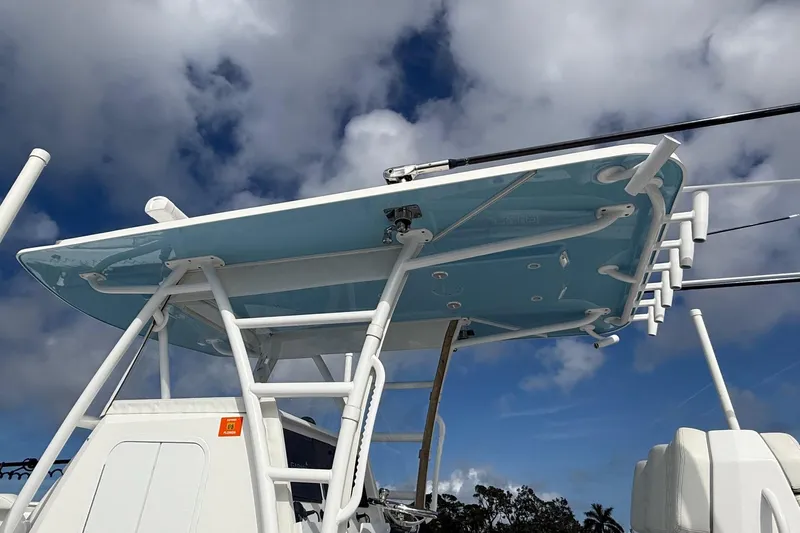  Yacht Photos Pics 2021 Invincible 36 CC boat with tower against cloudy sky.