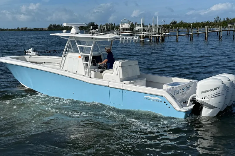  Yacht Photos Pics 2021 Invincible 36 CC boat with triple Mercury engines on the water.