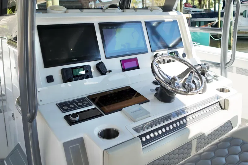  Yacht Photos Pics Invincible 46 Catamaran 2022 helm with advanced navigation screens and controls.