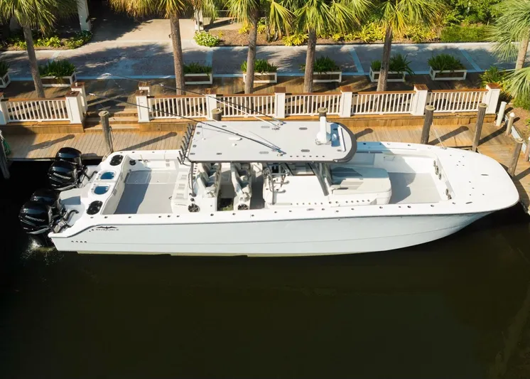  Yacht Photos Pics 2022 Invincible 46 Catamaran docked, featuring sleek design and powerful engines.