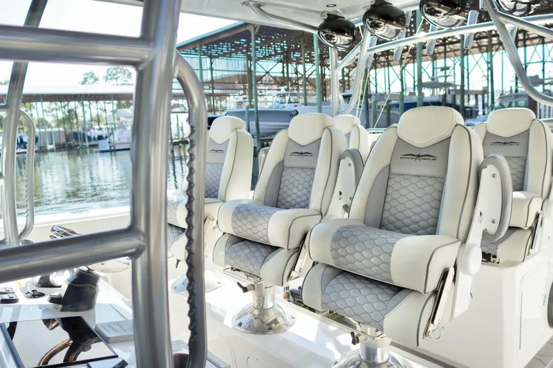  Yacht Photos Pics Luxurious seating on 2022 Invincible 46 Catamaran, featuring elegant design and waterfront view.