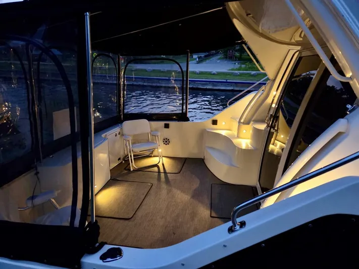  Yacht Photos Pics 2005 Carver 38 Super Sport yacht interior with ambient lighting and water view.