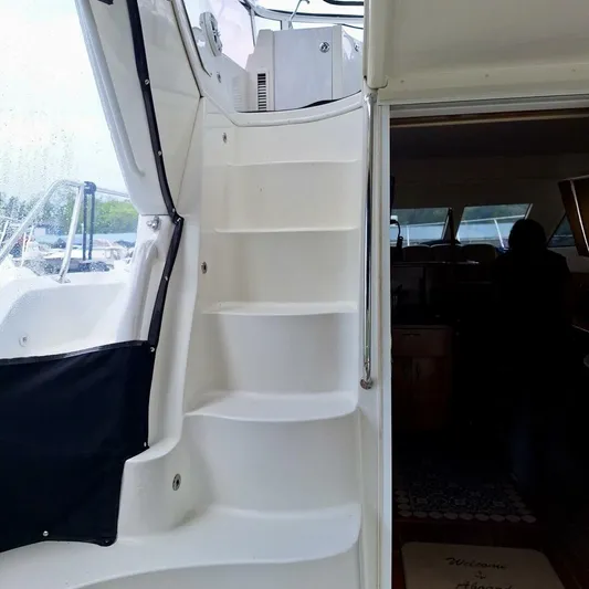  Yacht Photos Pics 2005 Carver 38 Super Sport yacht interior with white stairs and cabin entrance.