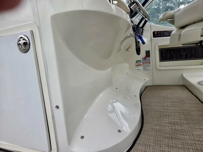  Yacht Photos Pics 2005 Carver 38 Super Sport helm area with steering wheel and control panel.