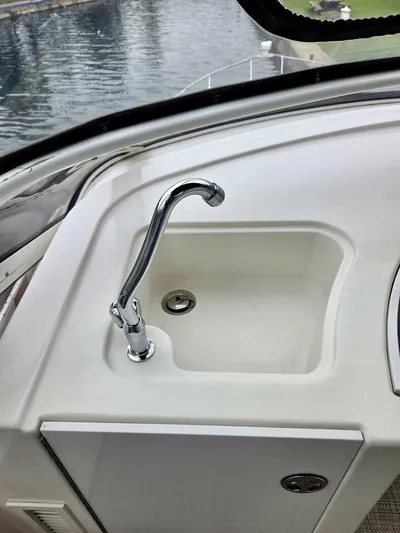  Yacht Photos Pics 2005 Carver 38 Super Sport boat sink with chrome faucet, dockside view.