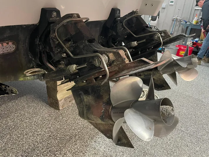 "abe Froman" Yacht Photos Pics 2006 Formula 330 Sun Sport boat propellers in a garage setting.