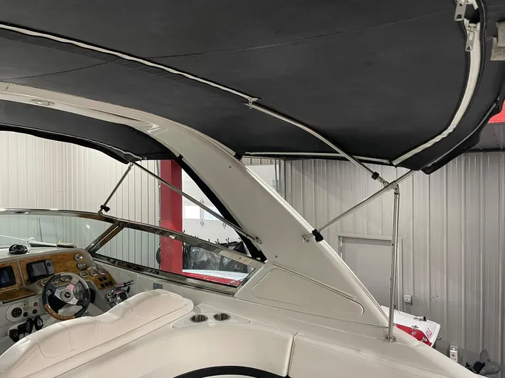 "abe Froman" Yacht Photos Pics Interior view of 2006 Formula 330 Sun Sport boat with canopy and dashboard.