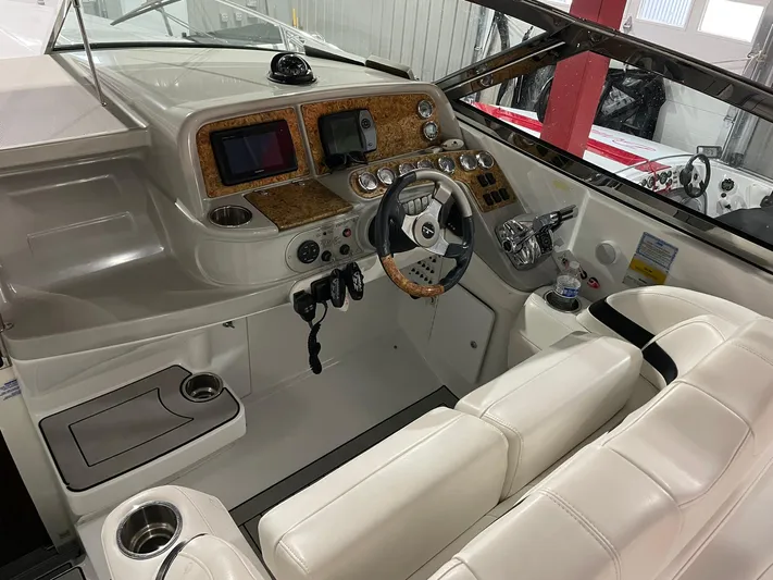 "abe Froman" Yacht Photos Pics 2006 Formula 330 Sun Sport boat interior with steering wheel and control panel.