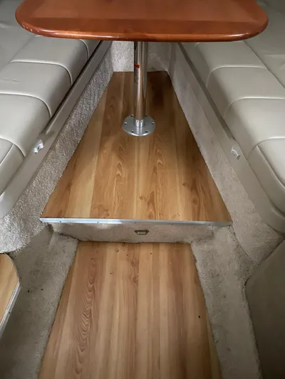 "abe Froman" Yacht Photos Pics 2006 Formula 330 Sun Sport interior with wood flooring and beige seating.