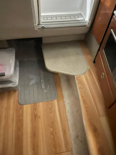 "abe Froman" Yacht Photos Pics Interior of 2006 Formula 330 Sun Sport with wood flooring and storage.