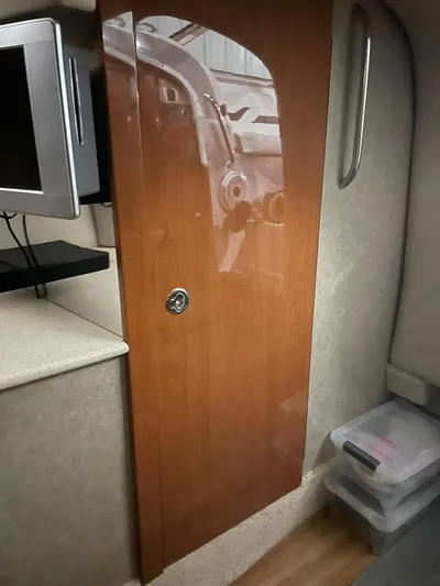 "abe Froman" Yacht Photos Pics Interior of 2006 Formula 330 Sun Sport boat with wooden cabinet and TV.