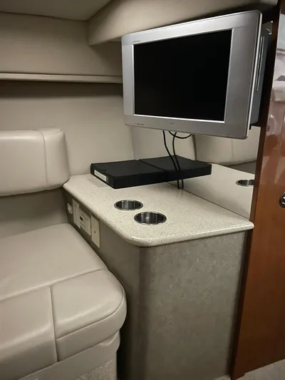 "abe Froman" Yacht Photos Pics 2006 Formula 330 Sun Sport cabin interior with TV and seating area.