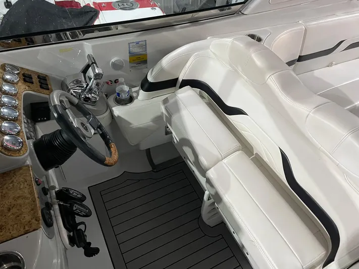 "abe Froman" Yacht Photos Pics 2006 Formula 330 Sun Sport boat interior with white seating and modern dashboard.