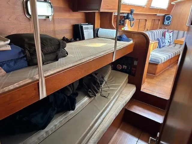 Equinox Yacht Photos Pics Interior of 1980 Irwin 46 Ketch sailboat with cozy wooden bunks and seating area.