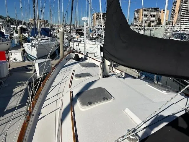 Equinox Yacht Photos Pics 1980 Irwin 46 Ketch sailboat docked in a marina, surrounded by other boats.