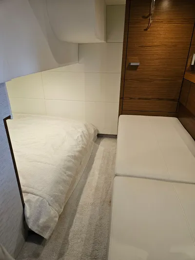  Yacht Photos Pics 2022 Tiara Yachts C39 Coupe interior cabin with bed and seating area.