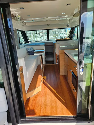  Yacht Photos Pics 2022 Tiara Yachts C39 Coupe interior with modern design and wood flooring.