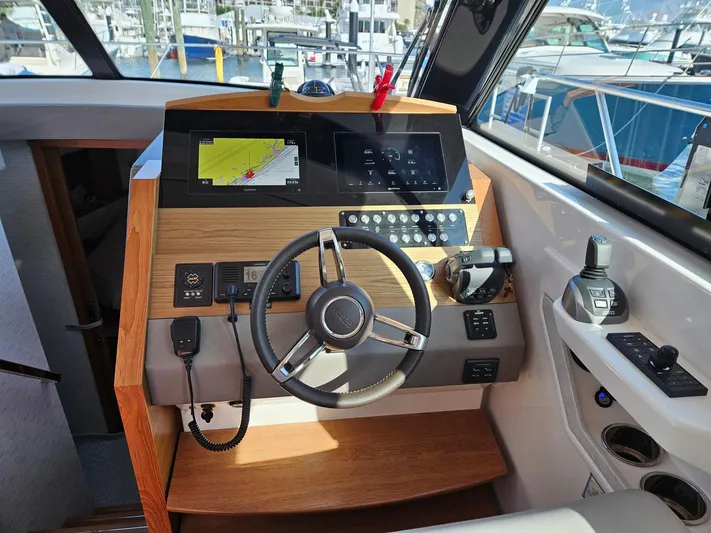  Yacht Photos Pics 2022 Tiara Yachts C39 Coupe helm with navigation display and controls.