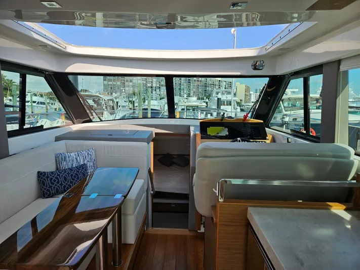  Yacht Photos Pics Interior of 2022 Tiara Yachts C39 Coupe with modern design and marina view.