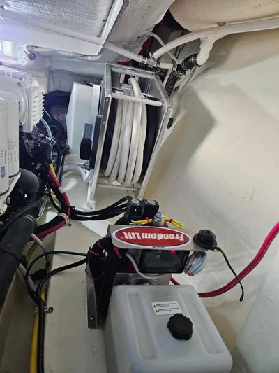  Yacht Photos Pics Engine room of 2022 Tiara Yachts C39 Coupe, showcasing mechanical components and wiring.