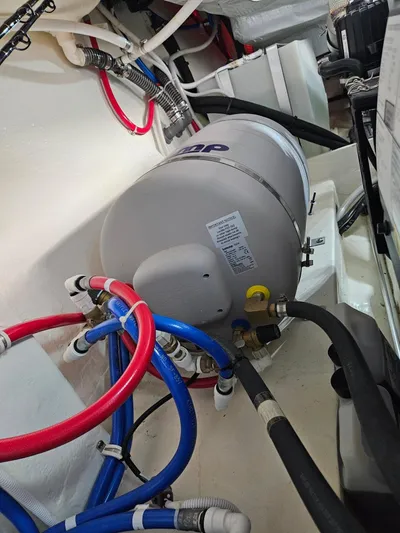  Yacht Photos Pics Engine room of 2022 Tiara Yachts C39 Coupe with plumbing and equipment.