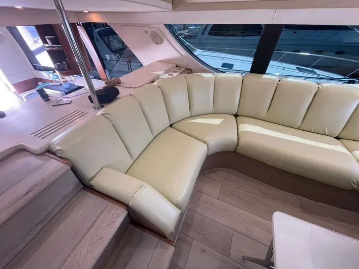 Relentless Yacht Photos Pics Luxurious interior of 1998 Carver 530 Voyager Pilothouse with cream leather seating.