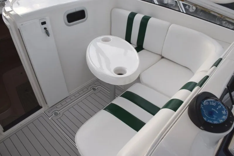 Cat Five Yacht Photos Pics Settee forward of helm with table, cabin entry