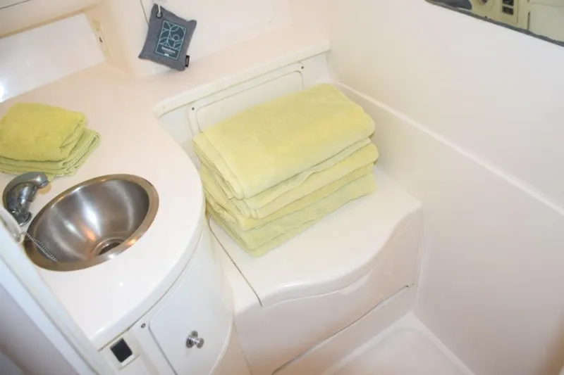 Cat Five Yacht Photos Pics Head with hideaway cover, mirror, sink