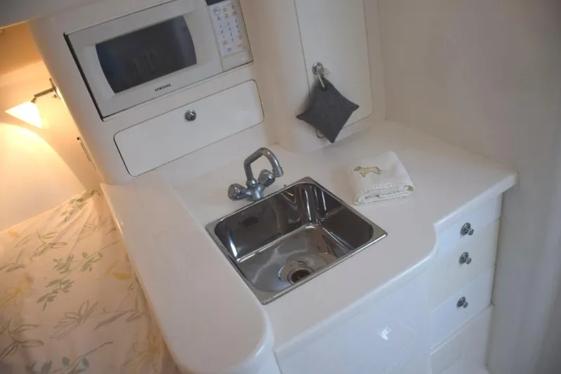 Cat Five Yacht Photos Pics Galley console, sink, microwave, drawer storage