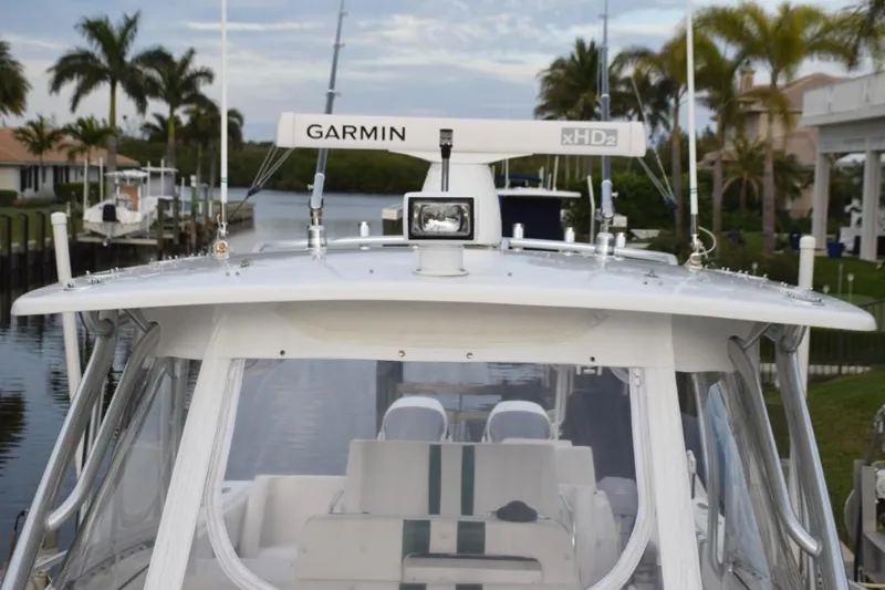 Cat Five Yacht Photos Pics Hardtop with spotlight, Garmin open array radar, outriggers