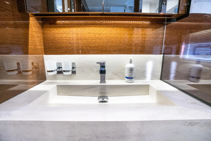 Compound Interest Yacht Photos Pics Luxurious bathroom sink on a 2018 Prestige 630 Yacht, featuring modern fixtures and elegant design.