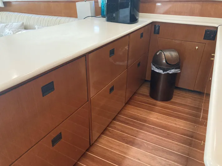  Yacht Photos Pics Interior of 1999 Viking 55 Sport Fish yacht with wooden cabinets and flooring.