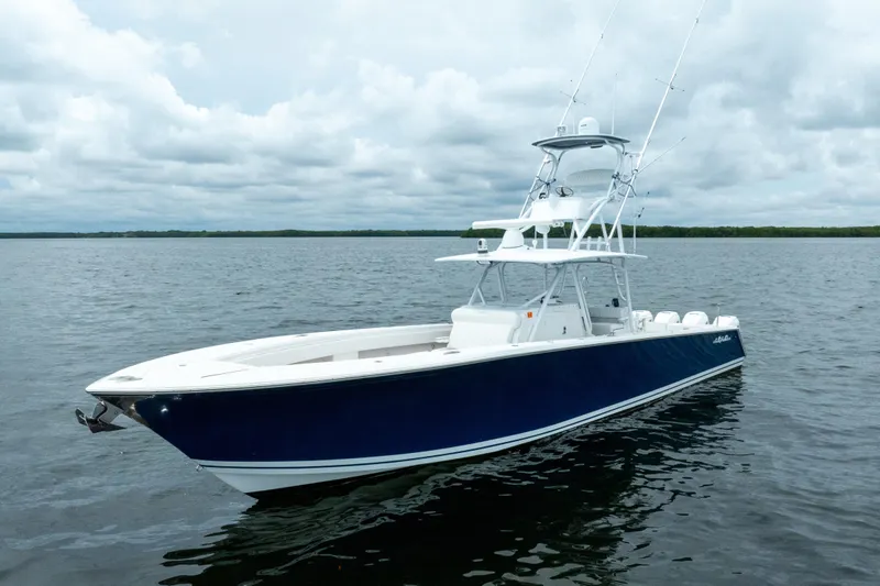  Yacht Photos Pics 2016 SeaHunter 45 boat on calm water under cloudy sky.