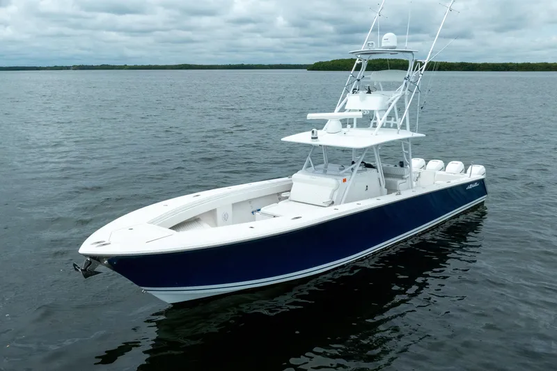  Yacht Photos Pics 2016 SeaHunter 45 boat on calm water, featuring sleek design and fishing equipment.