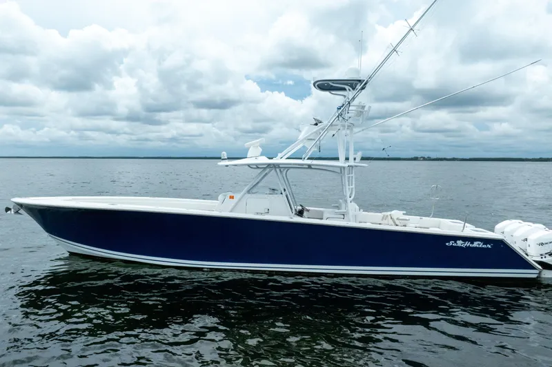  Yacht Photos Pics 2016 SeaHunter 45 boat on calm water under cloudy sky.