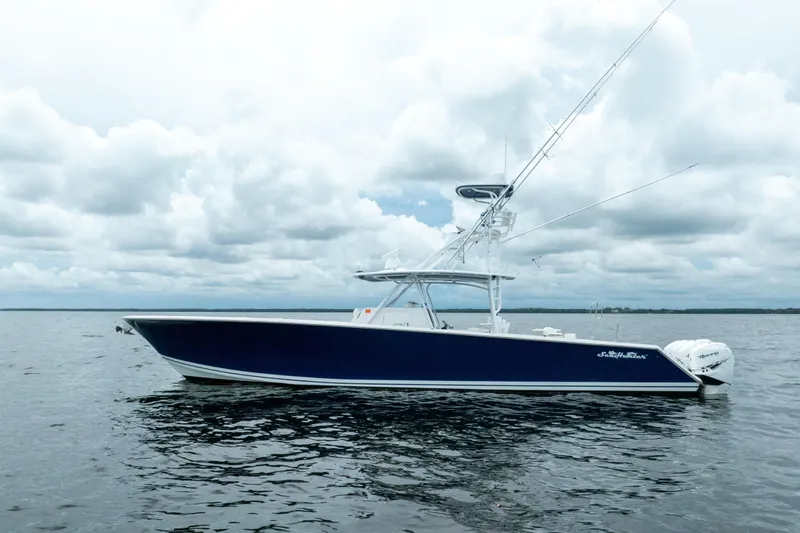  Yacht Photos Pics 2016 SeaHunter 45 boat on calm water under cloudy sky.