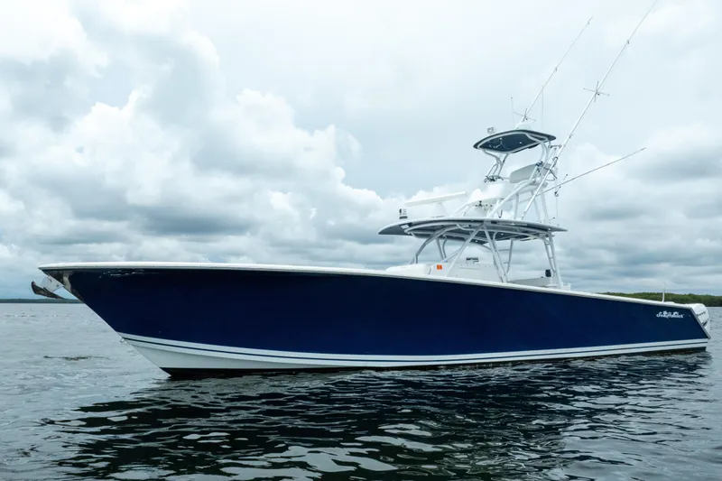  Yacht Photos Pics 2016 SeaHunter 45 boat on water under cloudy sky.
