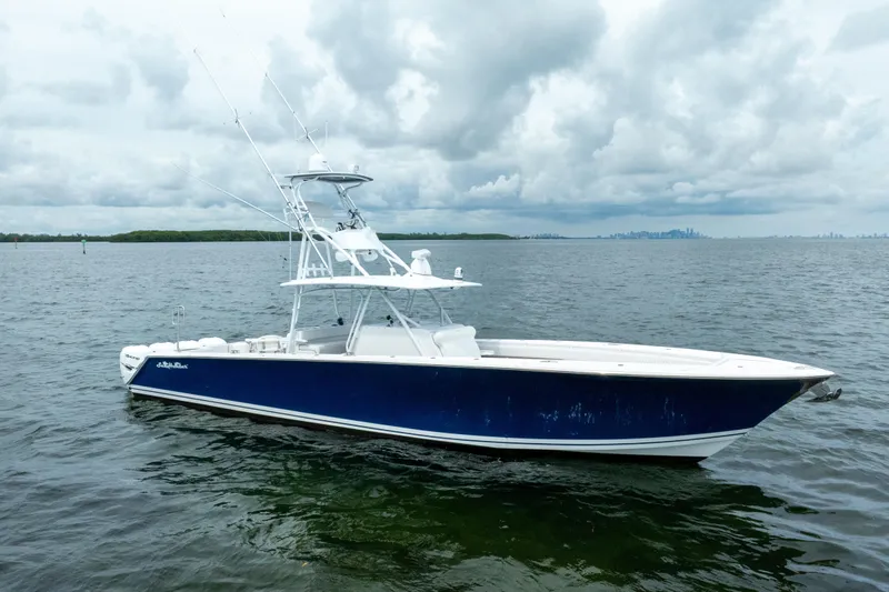  Yacht Photos Pics 2016 SeaHunter 45 boat on calm waters under cloudy skies.