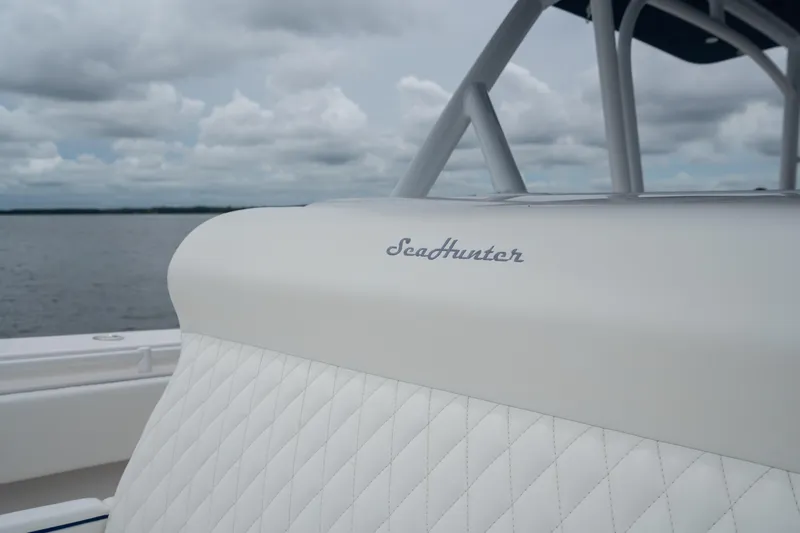  Yacht Photos Pics 2016 SeaHunter 45 boat with quilted white seating, cloudy sky background.