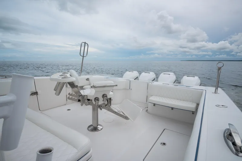  Yacht Photos Pics 2016 SeaHunter 45 boat with fishing chair, ocean view, and multiple outboard engines.