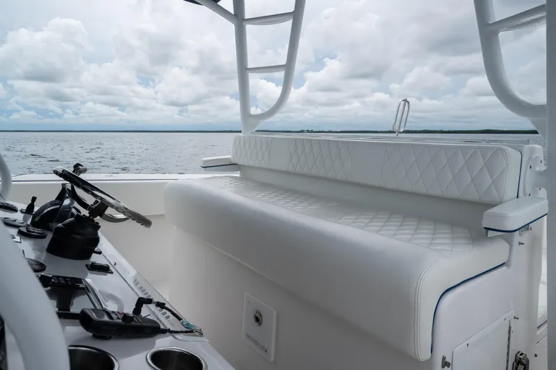  Yacht Photos Pics Luxurious seating on 2016 SeaHunter 45 boat with ocean view and cloudy sky.