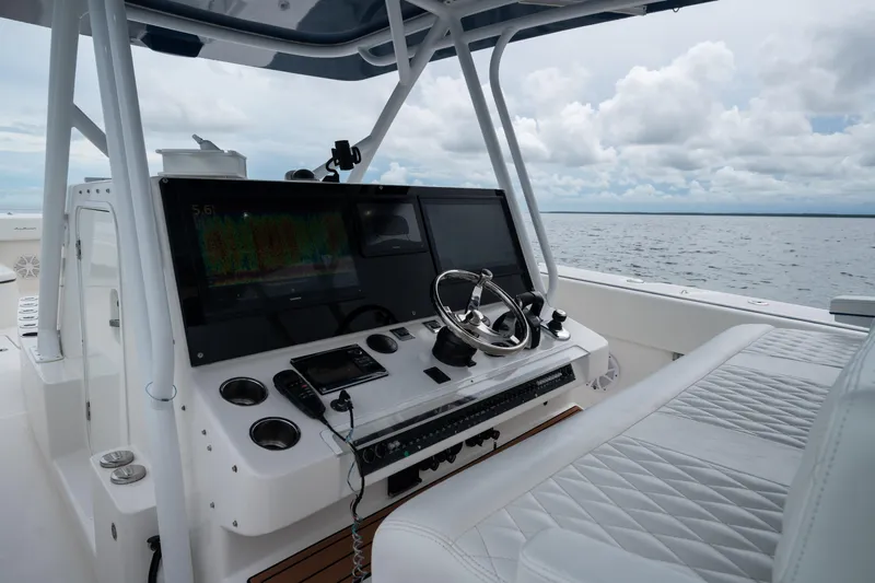  Yacht Photos Pics Helm of 2016 SeaHunter 45 boat with advanced navigation system and luxurious seating.