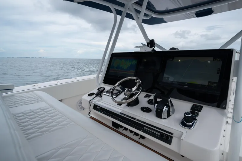  Yacht Photos Pics Cockpit of 2016 SeaHunter 45 boat with advanced navigation systems and ocean view.