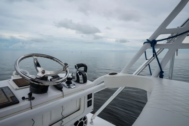  Yacht Photos Pics Helm of 2016 SeaHunter 45 boat with ocean view and cloudy sky.